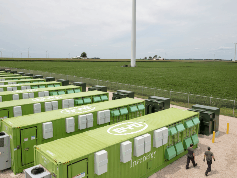 Invenergy Energy Storage with wind turbines in the background