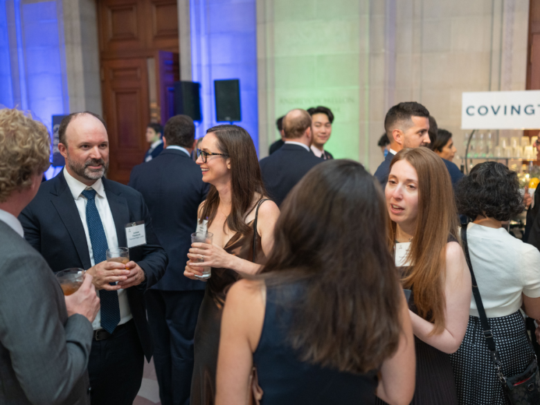 Attendees network during cocktail hour at the ACORE Gala.