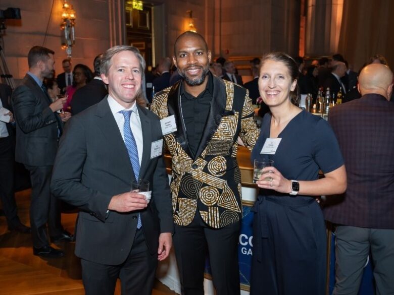 2025 ACORE Gala Attendees smiling for the camera at the Mellon Auditorium.
