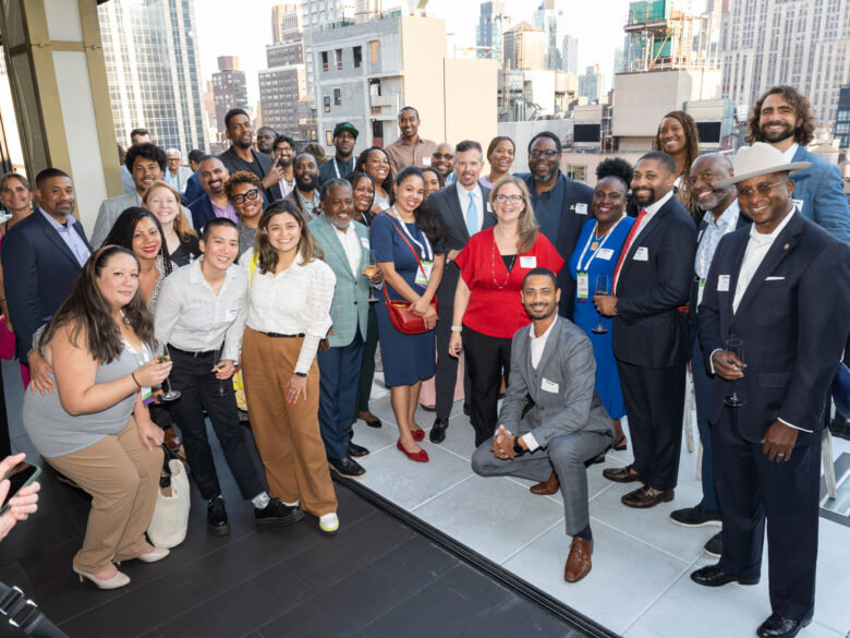 Accelerate members and alumni smiling for a group photo.