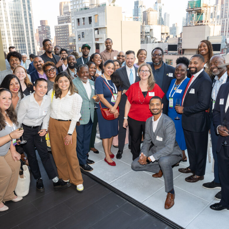 Accelerate members and alumni smiling for a group photo.