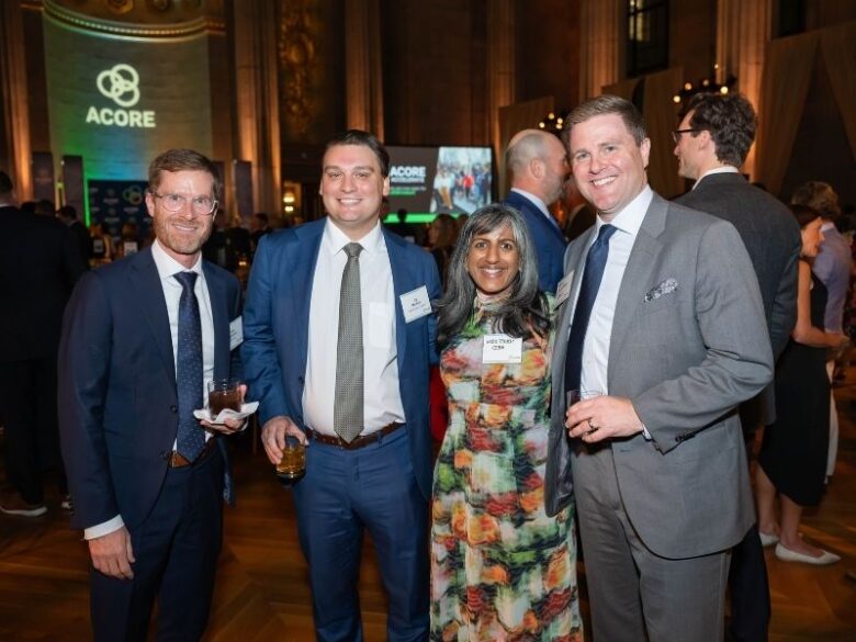 2025 ACORE Gala Attendees smiling for the camera at the Mellon Auditorium.