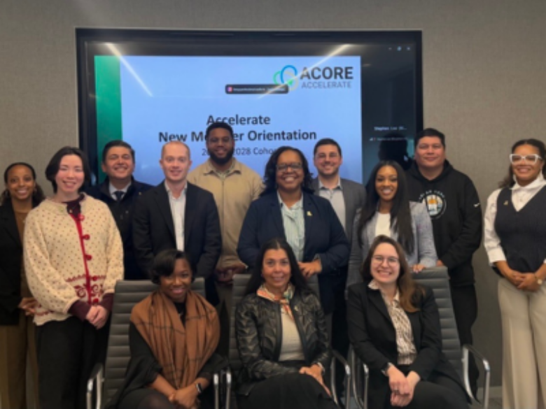 Accelerate cohort members smile for a group photo.