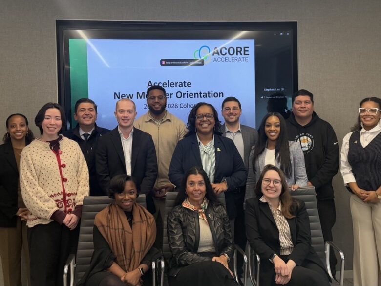 Accelerate cohort members smile for a group photo.