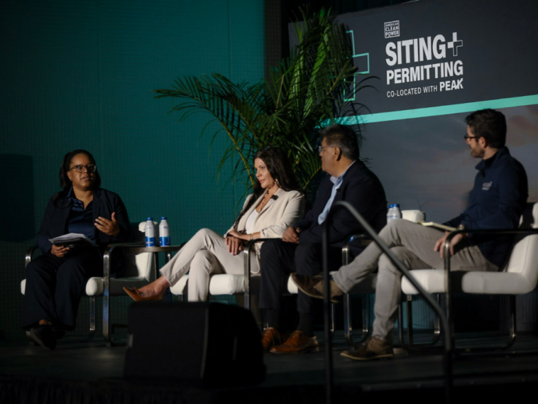 Four panelists sit on stage during American Clean Power Association’s Siting & Permitting Conference.