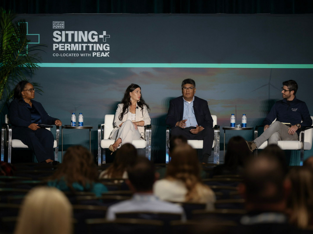 Four panelists sit on stage during American Clean Power Association’s Siting & Permitting Conference.