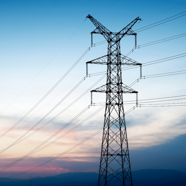 Transmission tower with sunset background.