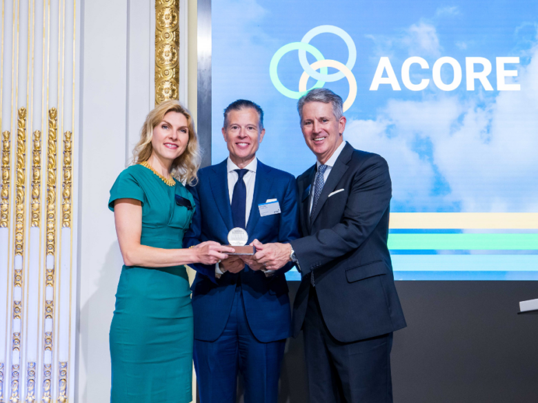 ACORE CEO and Board Chair accept an award at the NYSE.