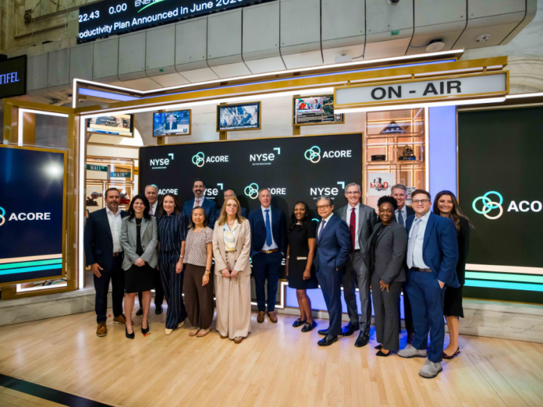 A group of ACORE team and board members pose for a group photo at the New York Stock Exchange after ringing the Opening Bell.