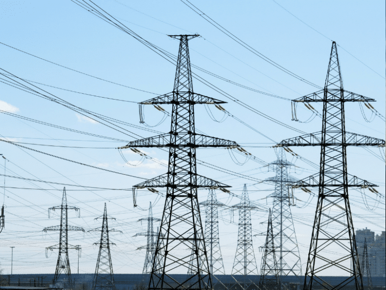 Multiple transmission towers and lines.